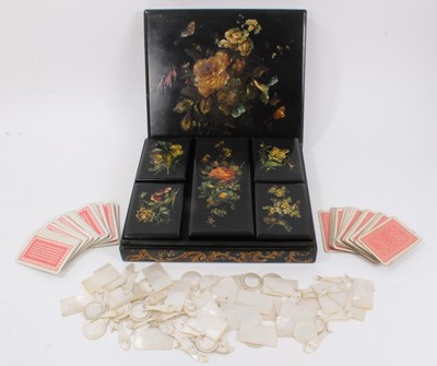 Lot 862 - 19th century papier mâché games box containing five boxes with playing cards and mother of pearl gaming counters including mother of pearl fish.