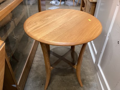 Lot 1292 - Ercol circular ocassional table with glass undertier, 60cm diameter