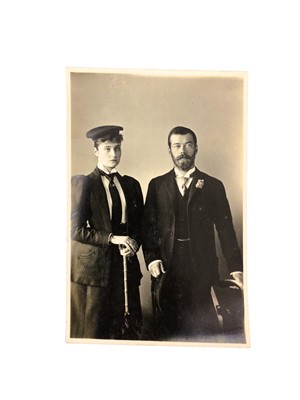 Lot 44 - H.R.H. Princess Alix of Hesse-Darmstadt (later Tsar Nicholas II and his consort), fine portrait photograph of the recently engaged Imperial couple wearing their yachting attire taken at Osborne on...
