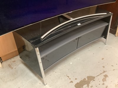Lot 1 - 75" Qled Curved Samsung TV together with Stand and remote control. Television currently turns on but not working as it's missing it's Fibre optic lead.