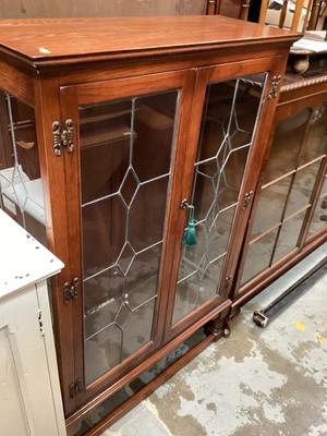 Lot 1299 - Old Charm oak display cabinet with glass shelves enclosed by two leaded glazed doors, 86.5cm wide, 33cm deep, 131.5cm high