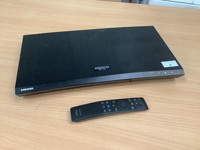 Lot 2 - Samsung Ultra HD Blu-ray player with remote control and wires