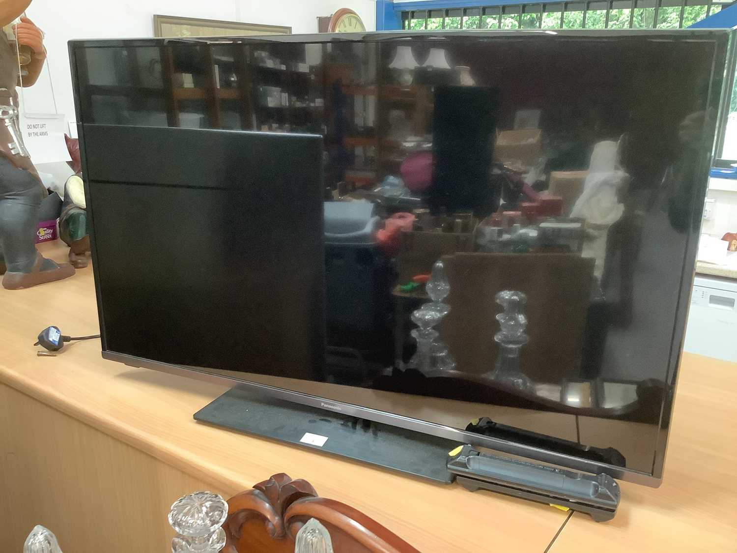 Lot 3 - 43" Panasonic Smart TV with remote control. Please not that it has a slight damage to the top of TV, please see images.