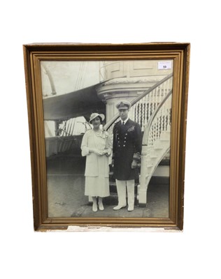 Lot 59 - T..M. King George VI and Queen Elizabeth, fine portrait photograph of the Royal couple on board the Royal Yacht Victoria & Albert, in gilt glazed frame 57 x 47 cm Provenance: the Russell & Sons Cou...
