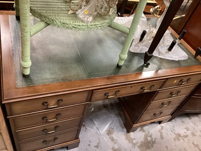 Lot 1305 - Georgian style mahogany twin pedestal kneehole desk with leather lined top and seven drawers below, 137cm wide, 75cm deep, 76cm high