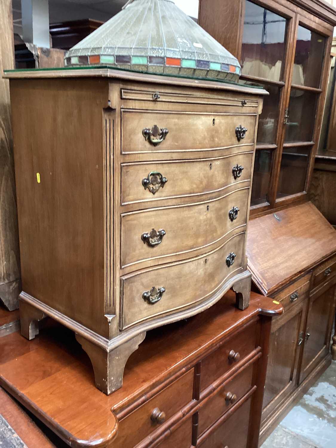 Lot 1317 - Georgian style mahogany serpentine fronted chest with brushing slide and four graduated drawers below, 71cm wide, 45cm deep, 79.5cm high