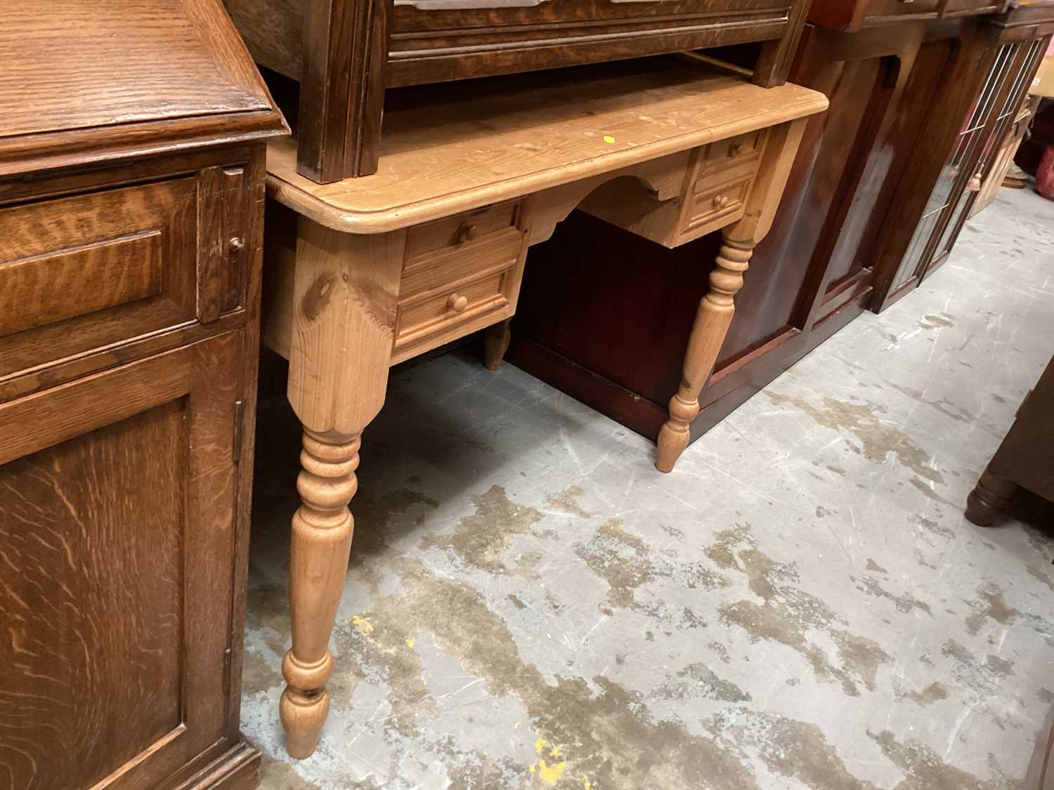 Lot 1321 - Pine kneehole dressing table with four drawers on turned legs, 107cm wide, 56cm deep, 76cm high