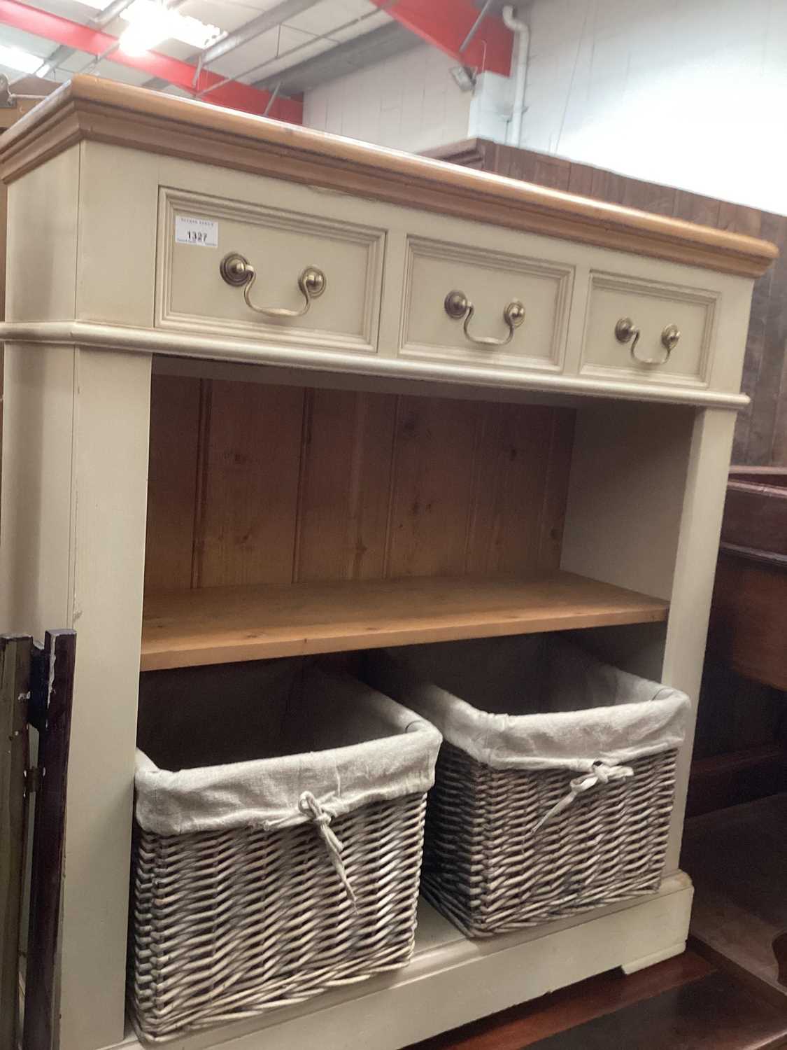 Lot 1327 - Painted pine open bookcase with three drawers, shelf and two wicker baskets below, 87cm wide, 30cm deep, 96cm high