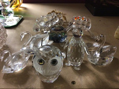 Lot 701 - Swarovski glass animals including penguin, swans and owl, plus paperweights, pair of candle sticks and art glass ware