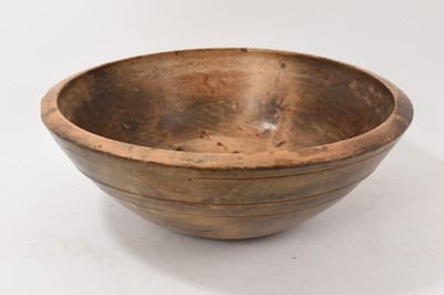 Lot 660 - A very large 18th / 19th century turned sycamore dairy bowl, with plain banded decoration, 49cm diameter x 17.5cm high