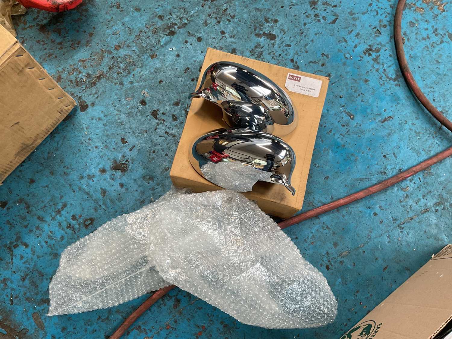 Lot 239 - Pair of new old stock Rover 75 chrome 'bullet' mirror covers, part number CRC100190MMM