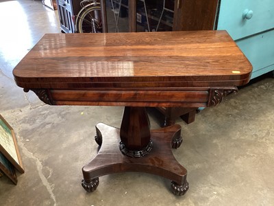 Lot 1336 - Regency rosewood tea table with fold over top on faceted column and quatrefoil base with turned receded feet, 91cm wide