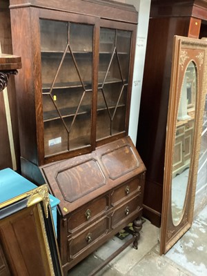 Lot 1337 - 1930's oak bureau bookcase with shelves above enclosed by two glazed doors, writing compartment and two geometric moulded drawers below, 88cm wide, 40cm deep, 198cm high