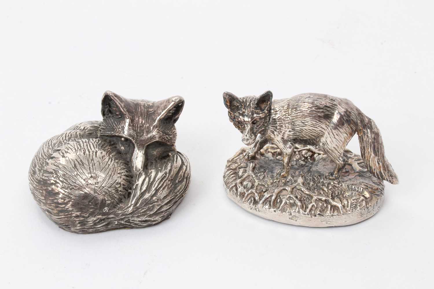 Lot 435 - Two filled silver models of foxes