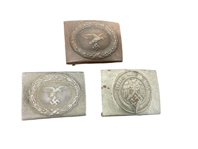 Lot 761 - Two Second World War Nazi German Luftwaffe belt buckles, together with a Hitler Youth belt buckle (3)