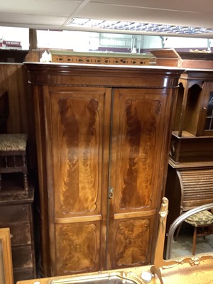 Lot 1350 - Early 20th century flame mahogany double wardrobe with panelled doors on splayed feet, 120cm wide, 82cm deep, 201cm high