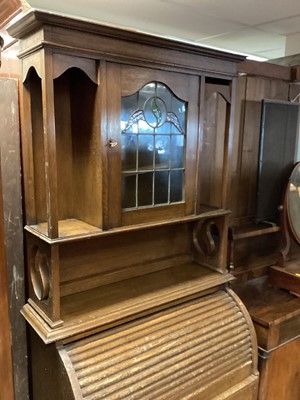 Lot 1352 - Edwardian oak bureau bookcase with leaded glazed door above, tambour shutter, single drawer and two panelled doors below, 82.5cm wide, 40.5cm deep, 199cm high