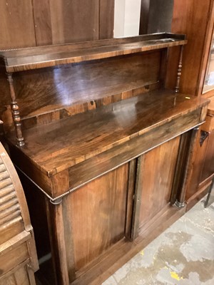 Lot 1354 - Regency rosewood chiffonier with raised ledge back and turned supports, frieze drawer and two panelled doors below, 113cm wide, 37.5cm deep, 127cm high