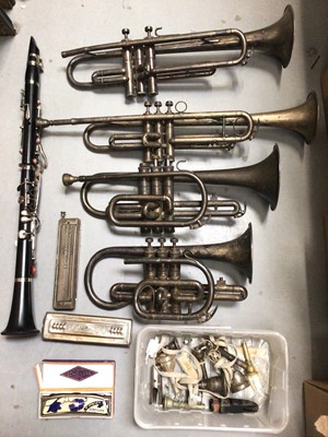 Lot 439 - Two trumpets, two hornets, a clarinet, mouth pieces, accessories and three harmonicas