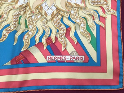 Lot 2153 - Hermès silk scarf Les Sangles De Phoebus designer J Metz, in orange Hèrmes box and with brown ribbon.