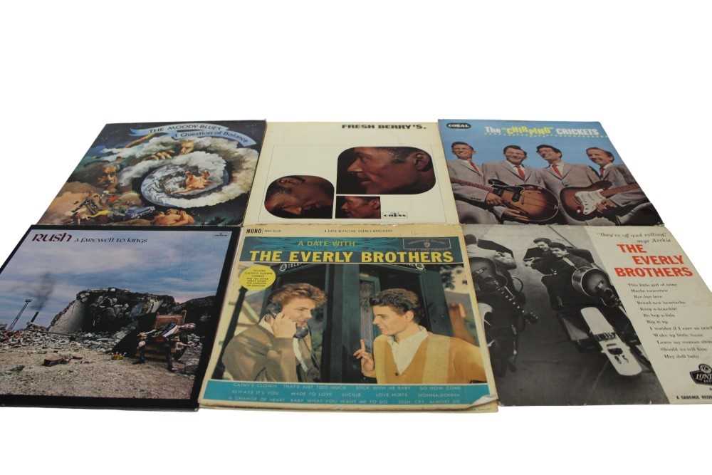 Lot 2228 - Three vintage brown cases of LP records including John Lee Hooker, The Rolling Stones, Moody Blues, Rush, Robin Trower, T-Bone Walkers, Chuck Berry, The Everly Brothers, The Crickets and Stephen St...