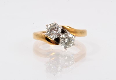 Lot 745 - Two stone cross-over ring set with moissanite stones