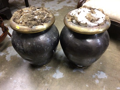 Lot 710 - Pair of hammer beaten urns, for flower displays