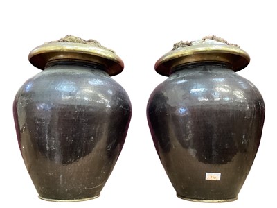 Lot 620 - Pair of hammer beaten urns, for flower displays