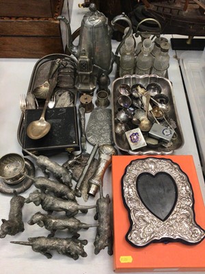 Lot 446 - Silver plate and metal ware including hound ornaments, photo frame, glass condiment set in stand, napkin rings, flatware etc