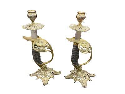 Lot 756 - Pair of brass candlesticks fashioned from a pair of Imperial German 1889 pattern infantry officers sword hilts