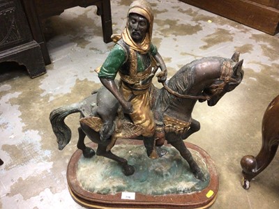 Lot 716 - Cast metal Arab on horseback, with wooden plinth, 58 cm high