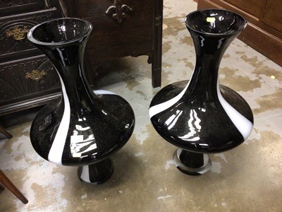 Lot 718 - Pair of glass bulbous body and fluted neck art glass vases, 68 cm high