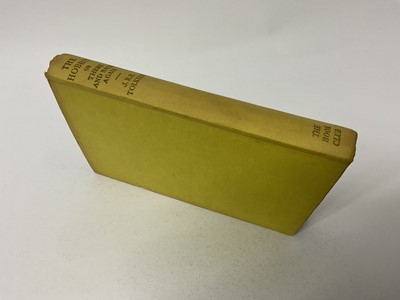 Lot 1702 - J R R Tolkien, The Hobbit, 1942 Children's Book Club edition, yellow cloth binding