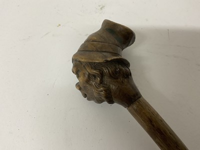 Lot 283 - 19th century novelty carved wooden walking stick with stylised head knop, 79cm long