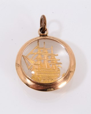 Lot 708 - Victorian 9ct gold fob with an engraved and pierced gold image of HMS Victory in double-sided glazed gold pendant mount, Birmingham 1891.