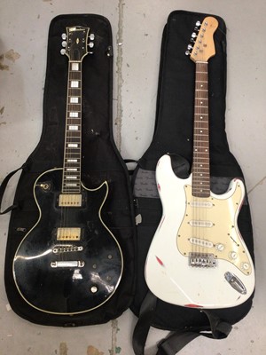 Lot 478 - Columbus electric guitar and one other, both in Fender carry cases