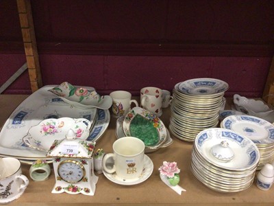 Lot 739 - Royal Albert mantle clock, Coalport Revelry dinner and tea ware, other tea ware, cups and saucers, plus Wedgwood farming plates (4 shelves))