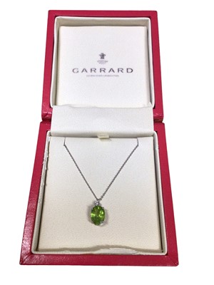 Lot 81 - Garrard & Co. peridot and diamond pendant in 9ct white gold setting on chain