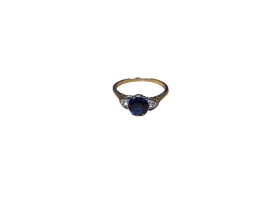 Lot 58 - Sapphire and diamond three stone ring with heart shape diamond shoulders on 18ct gold shank