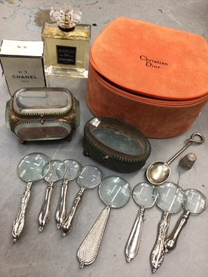 Lot 491 - Christian Dior vanity case containing two Chanel perfumes, two Victorian glass trinket boxes, collection of small magnifying glasses and other items