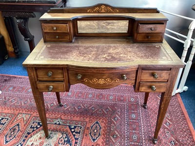 Lot 1435 - Late Victorian inlaid rosewood writing table with raised ledge and bevelled mirror back flanked by four short drawers, leather lined top and five drawers below on square taper legs, 91cm wide, 45cm...