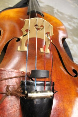 Lot 2235 - Early 20th century double bass by Hawkes, in soft case together with a cased German bow