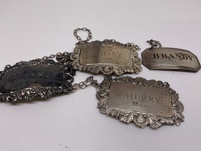 Lot 1115 - Three silver and one Old Sheffield plate spirit labels