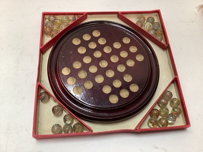 Lot 2414 - Vintage solitaire board with 33 coloured lattice twist glass marbles, in in original red card box