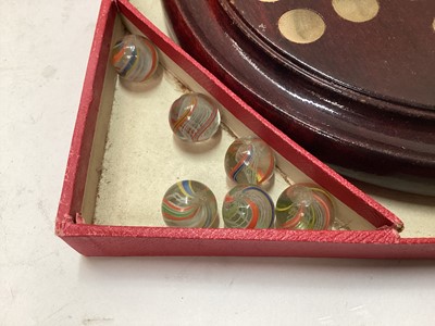 Lot 2414 - Vintage solitaire board with 33 coloured lattice twist glass marbles, in in original red card box