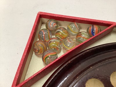 Lot 2414 - Vintage solitaire board with 33 coloured lattice twist glass marbles, in in original red card box