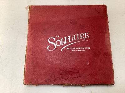 Lot 2414 - Vintage solitaire board with 33 coloured lattice twist glass marbles, in in original red card box