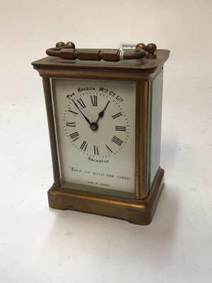 Lot 2407 - French brass carriage clock with white enamel dial marked "The Reason MFD Co. Ltd." "Keep up with the times"