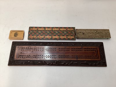 Lot 2471 - Four antique cribbage boards to include a Regency cribbage board, Mauchline ware cribbage board, Tartan ware and a carved and inlaid wooden cribbage board (4)