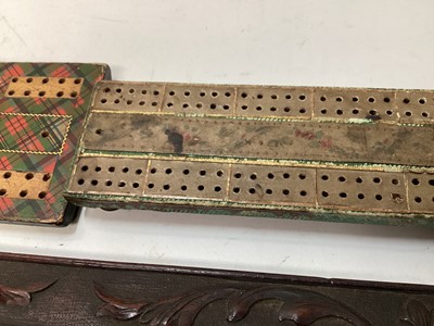 Lot 2471 - Four antique cribbage boards to include a Regency cribbage board, Mauchline ware cribbage board, Tartan ware and a carved and inlaid wooden cribbage board (4)